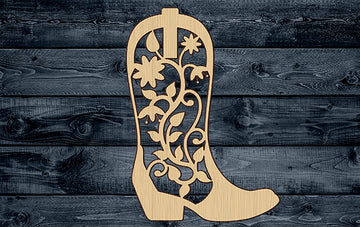 a wooden cowboy boot with flowers on it